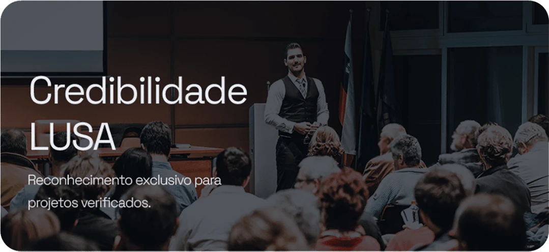 LUSA Credibility — be recognized worldwide for your excellence. A speaker in front of a packed auditorium.